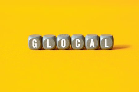 Glocal - word concept on building blocks, textの写真素材