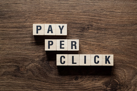 Pay per click - word concept on building blocks, textの写真素材