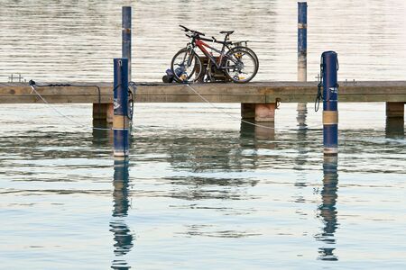 Bicycles are left on the lake bridge. Tranquil sceneの写真素材