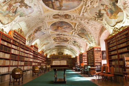 Library with ancient books, old globes, bookshelves, furniture in Theological Hall with stucco decoration Strahov monastery Czech Republic Prague Library with ancient books, old globes, bookshelves, furniture in Theological Hall with stucco decoration Strahov monastery Czech Republic Prague