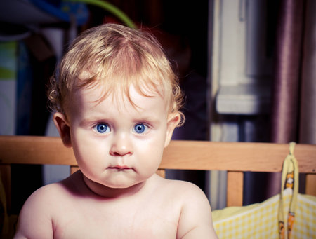A portrait of a beauty young boy at homeの写真素材