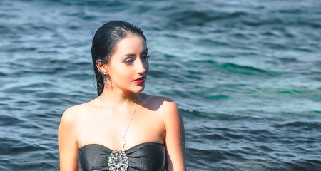 Brunette on a beachの写真素材