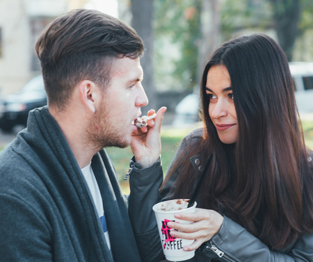 Younge couple walking in a parkの写真素材