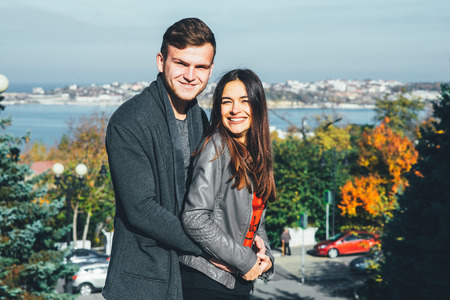 Younge couple walking in a parkの写真素材