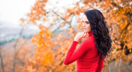 Young pretty brunette outdoors at autumnの写真素材