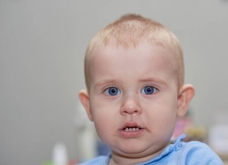 Young baby boy playing at home