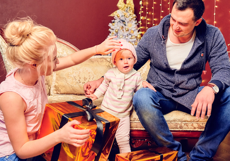 Young family with a little daughter in studioの写真素材