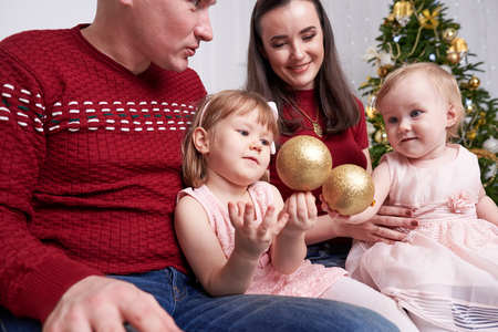 A portrait of a happy family with two little daughtersの写真素材