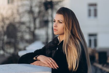 Young pretty blonde on a streetの写真素材