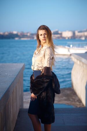 Young pretty blonde on a streetの写真素材