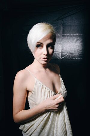 Pretty sexy blonde on a black backgroundの写真素材