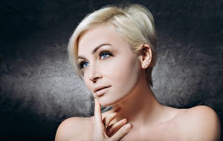 Pretty sexy blonde on a black background