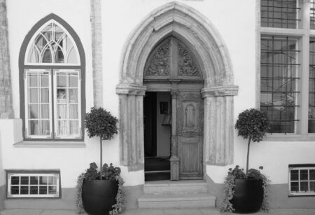 Entrance portal of the medieval buildings in the old Tallinn. Architectural ensemble of the Three Sistersの写真素材