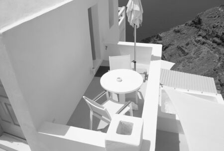 A small cozy balcony in Fira on the island of Santorini in Greeceの写真素材