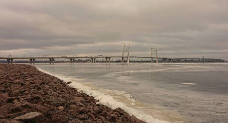 Gloomy December day and view of the expressway from Vasilyevsky Island in St. Petersburgの写真素材