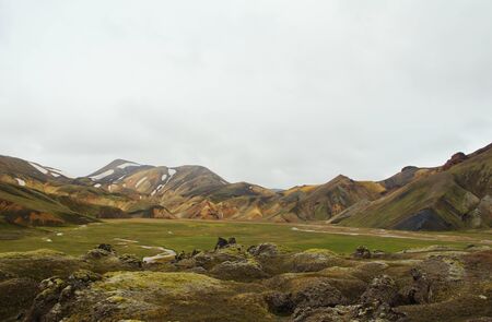 A cool summer Icelandic morning and a new hike in the colored mountains of the Landmannalaugar Natural Parkの写真素材