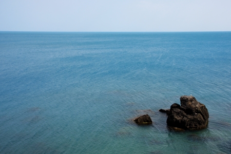 A lonely expanse of rock in the waterの写真素材
