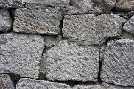The old wall was built of stoneの写真素材