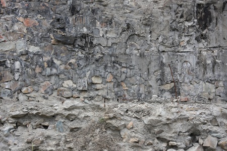 The old wall was built of stoneの写真素材