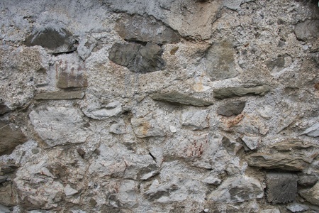 The old wall was built of stoneの写真素材