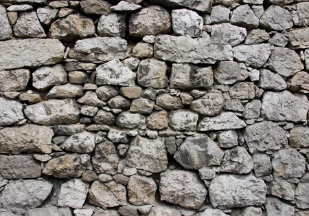 The old wall was built of stoneの写真素材