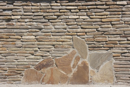 The old wall was built of stoneの写真素材