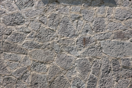 The old wall was built of stoneの写真素材