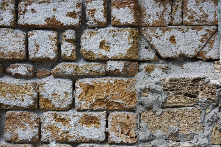 The old wall was built of stoneの写真素材
