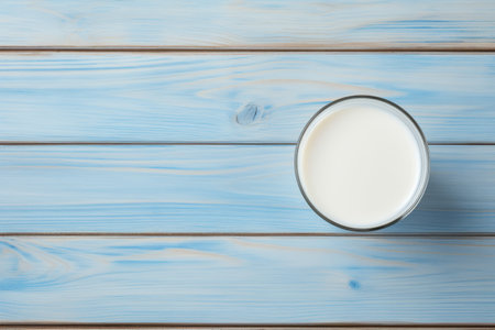Milk Bliss: A Refreshing Slice of Serenity on a Blue Wooden Canvasの素材