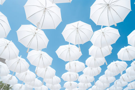The Elegant Charm of White Patio Umbrellas: Captivating Low-Angle Snapshot --ar 3:2の素材