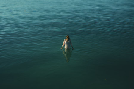 Captivating Serenity: Embracing the Person on the Body of Waterの素材