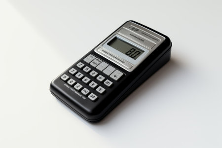 Modern Minimalism: Captivating Black and Silver Calculator Against a Clean White Table -- AR 3:2