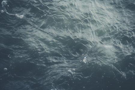 Captivating Visuals: A Close-Up View of Waters on a Serene Grey Surfaceの素材