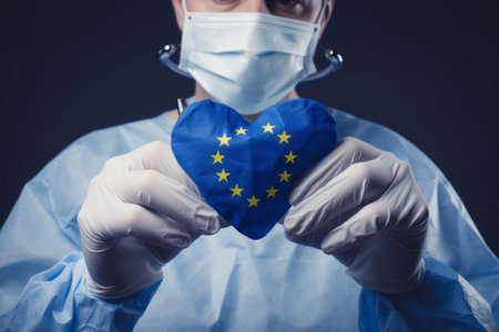 Symbolic Unity: European Union Flag Heart Grasped by Surgeons Handsの素材