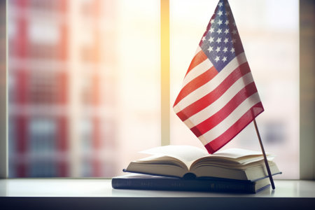 Blurred Patriotism: Education Concept in Focus with Books on White Table and USA Flag by Windowの素材