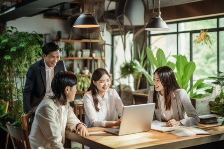 Sparkling Asian Creative Team Engages in Dynamic Brainstorming at Innovative Office Workspaceの素材