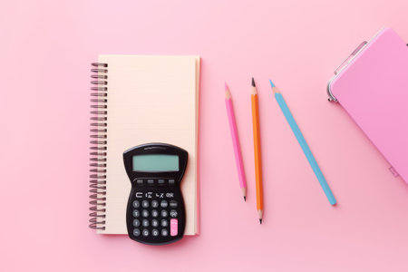 Stationery Gadgetry: Calculator and Headphone-themed Delights on a Vibrant Pink Canvasの素材
