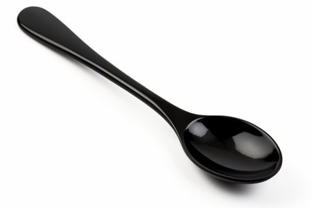 Contrasting Contrivance: Black Soup Ladle Embraced by a Pristine White Backgroundの素材