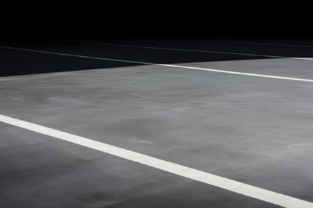 Enhancing Car Park Aesthetics with Landscape White Line on Grey Cement Floorの素材