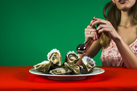 Vintage French Delight: Captivating Food Pop Art Photography of a Woman Savoring Oyster on a Vibrantの素材
