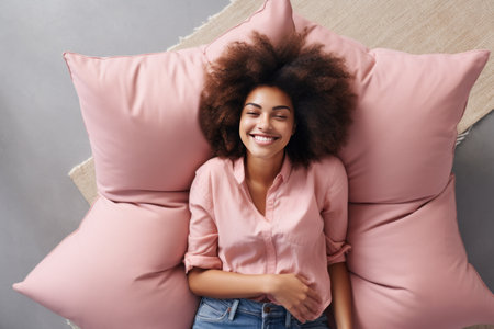 Blissful Relaxation: A Joyful Black Lady Enjoys Free Time on a Bean Bag in her Living Roomの素材