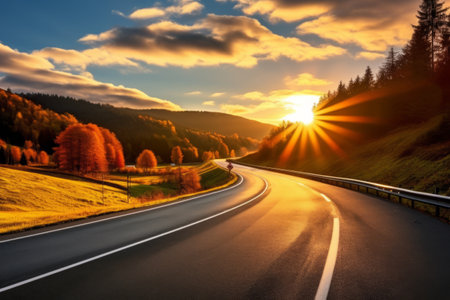 Serenity at Dusk: Captivating Sunset over Vibrant Color-Infused Black Asphalt Roadの素材