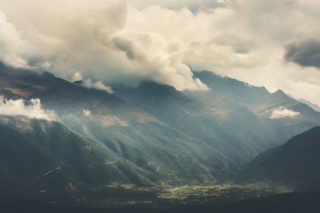 Majestic Mountain Range: A Serene Landscape Under a Cloudy Skyの素材