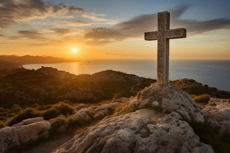 Majestic Sant Salvador Cross: A stunning sunrise over the ancient stone in Majorcaの素材