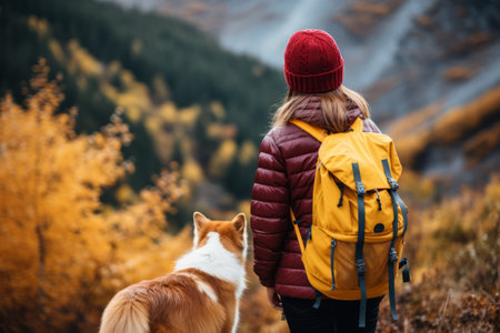 Autumn Adventures: A Woman Tourist's Mountain Journey with Her Loyal Ginger Dogの素材