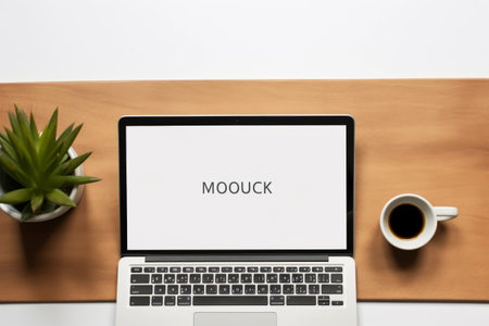 Unleashing Business Potential: Crafting Digital Strategies with an Open Laptop, Coffee Cup, and Ring Binder on an Office Deskの素材