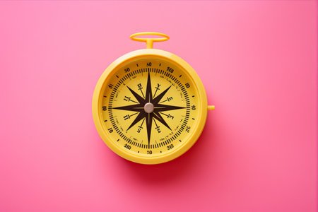 Vibrant Tools: Pink Compass and Protractor Set on a Bright Yellow Backgroundの素材