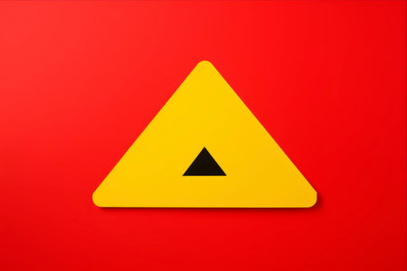 Highly Hazardous: Attention and Danger Marked - Cautionary Exclamation Sign on Red Background with Copy Spaceの素材