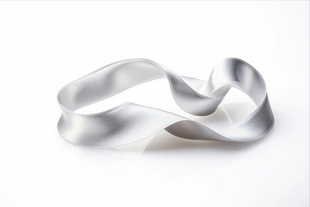 Delicate Elegance: Captivating Silver Silk Curly Ribbon on White Backgroundの素材