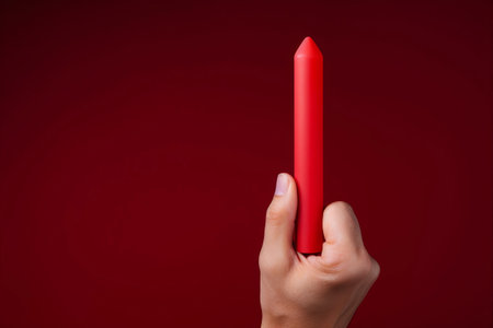 Symbolizing Urgency: Hand Gripping the Red Exclamation Pointの素材